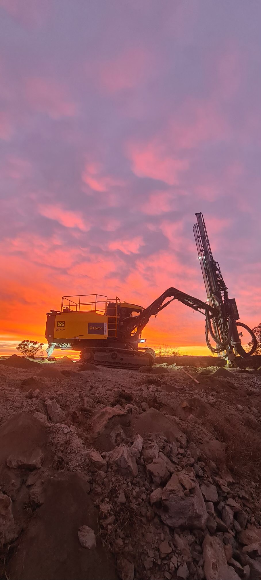 drill rig in sunset
